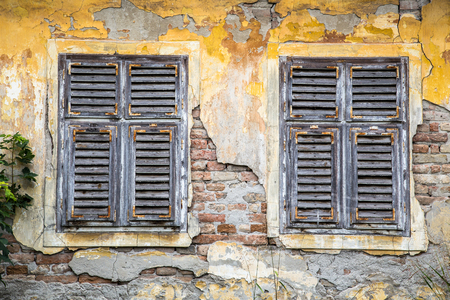 Old brick building with wooden windowsの写真素材