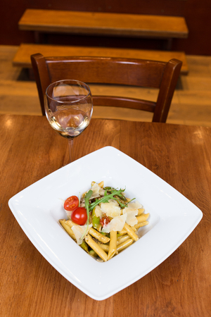 Imperatore Romano pasta with glass of wineの写真素材