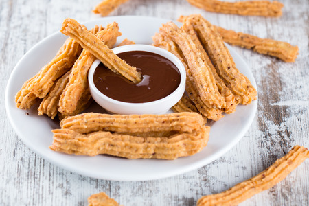 Traditional Spanish dessert churros with chocolateの写真素材