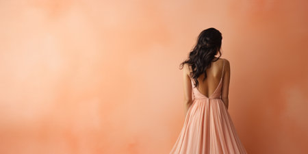 Ai generation. Young woman in long dress on peach background. Back view. Fashionの素材