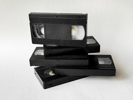 Retro vhs tapes stack on white background: nostalgia and vintage media trendの写真素材