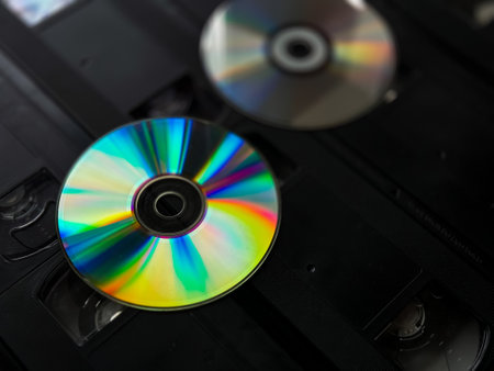 Retro revival: dvds and vhs tapes highlight the evolution of media formatsの写真素材