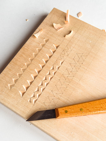 Wood carving techniques on softwood with precision knife and geometric patterns