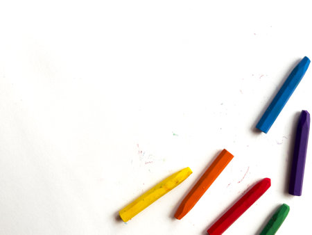 Colorful crayons arranged on white background for creative art projectsの写真素材