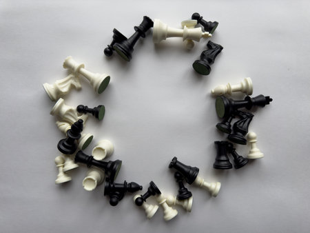 Circular arrangement of chess pieces on white backgroundの写真素材