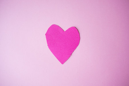 Pink heart shape on light pink backgroundの写真素材