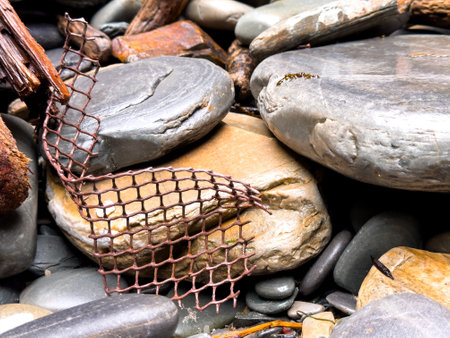 Rock garden. Natural stones and rusted mesh creating a rustic outdoor landscapeの写真素材
