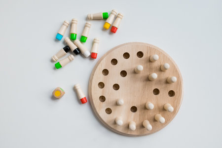 Wooden Montessori counting game with colorful pegs and diceの写真素材