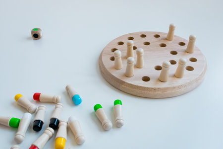 Colorful peg board game with wooden pegs for strategy and fun