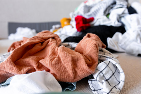 Pile of mixed laundry with various textures in bright colorsの写真素材