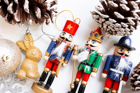 Festive nutcracker soldier ornaments and pinecones display for holiday decor
