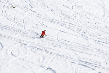 Skiing adventure on snowy mountain with tracksの写真素材