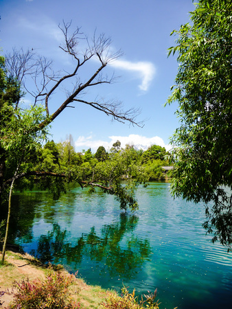 Idyllic lake in front of the Jade snow mountains in Lijiang, Chinaの写真素材