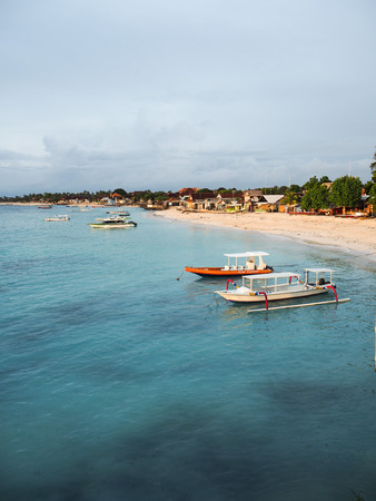 Setting sun shining on Jungutbatu coastal village on Nusa Lembongan, Baliのeditorial素材