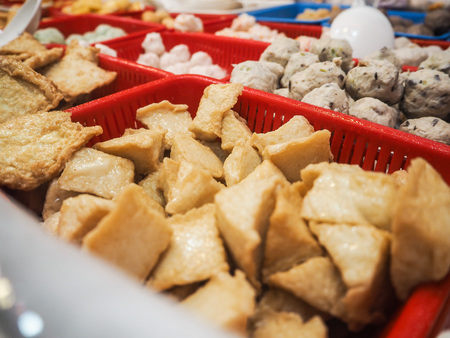 Siu mai, stinky tofu and fish balls in small containers sold at a street food stall in central Hong Kongの写真素材