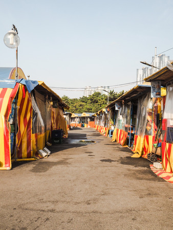 Busan, South Korea - June 2017: multiple food stalls at the seafood market next to Haeundae beachの写真素材
