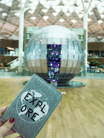 April 2018, South Korea: Person holding a inspirational passport cover in the newly opened terminal...