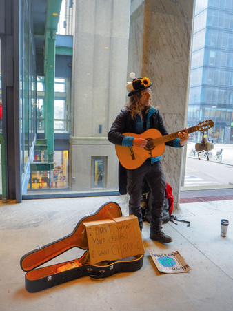 January 2019 - Brussels, Belgium: male street artist playing guitar during a climate change protest rally as a call to actionのeditorial素材