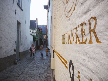 October 2018 - Mechelen, Belgium: Narrow alley leading to the old original entrance of the brewery Het Anker in the beguinage in the old townのeditorial素材