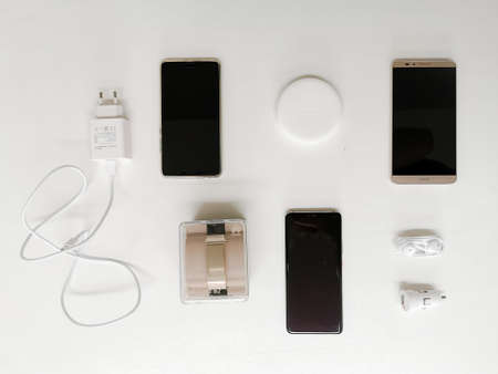 July 2020 - Belgium: Collection of unboxed Huawei devices such as smartphones, a talkband and ear budsのeditorial素材