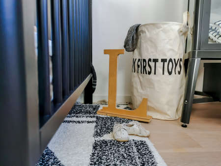 Contemporary black and white baby nursery with a large storage bag for toys.の写真素材