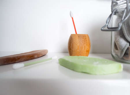 Zero waste bathroom concept with plastic free and reusable products such as silicone cotton swabs....
