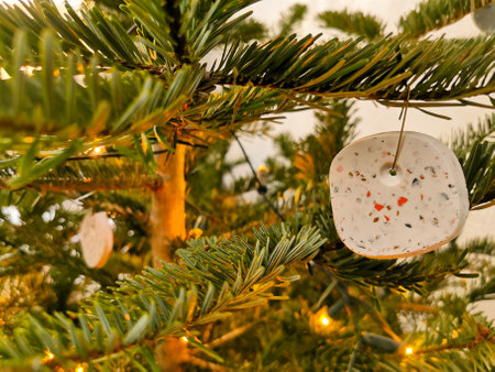 Modern handmade terrazzo christmas ball hanging in the christmas treeの写真素材