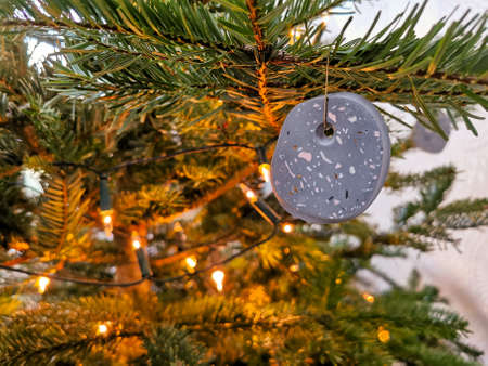 Modern handmade terrazzo christmas ball hanging in the christmas tree