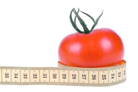 fresh Tomato with measuring tape on white backgroundの写真素材