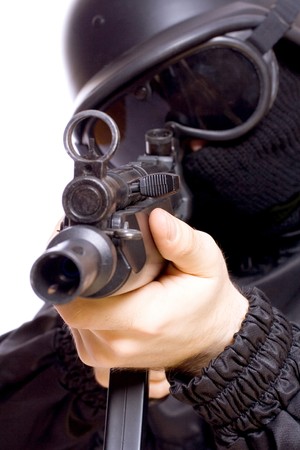 one soldier with the gun in the hands on a white backgroundの写真素材