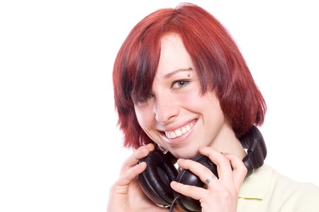 isolated smiling young girl listening to musicの写真素材