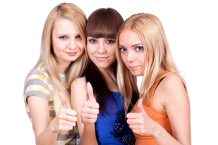 three girlfriends together giving thumbs-up on a white background    の写真素材