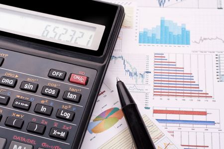 financial statement with calculator and penの写真素材