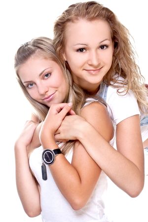 two beautiful women in a white T-shirts on a white background isolatedの写真素材