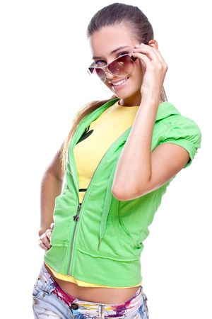 woman in a yellow shirt and green jacket posing on a white backgroundの写真素材