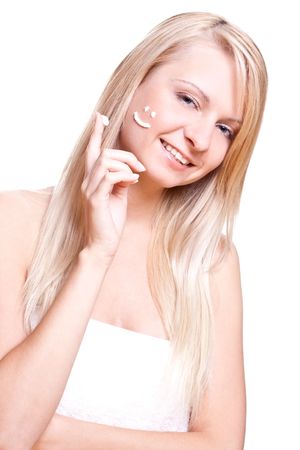 beautiful woman with cream on a white backgroundの写真素材