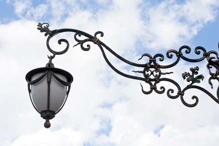 forged pattern streetlamp in the sky backgroundの写真素材