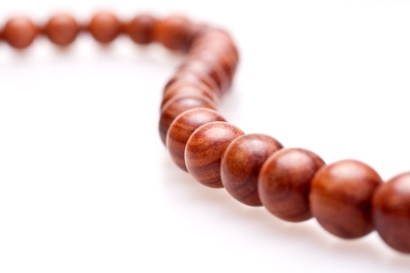 wooden beads on a white backgroundの写真素材