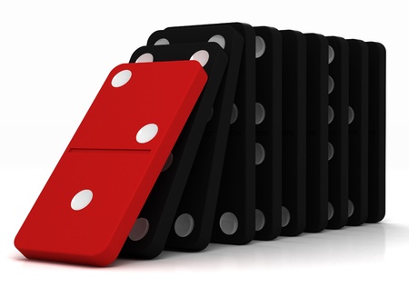 black dominoes falling over on a white backgroundの写真素材