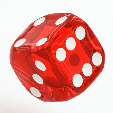 one red dice falling on a white backgroundの写真素材