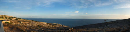 Panoramic view of Wied Iz-Zurrieq, Malta, showing the small valley leading down to the sea which gives the area its name - 'wied' being the maltese word for 'valley'.の写真素材