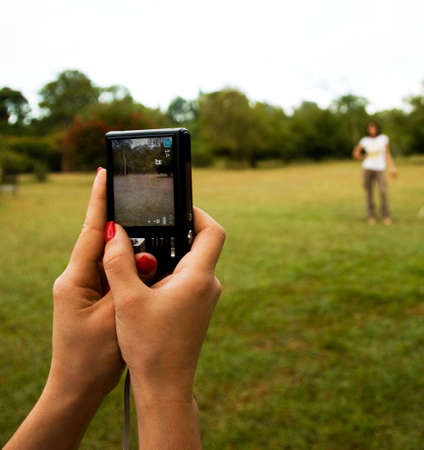 An unidentified person having her photo taken but not showing up on the screen.