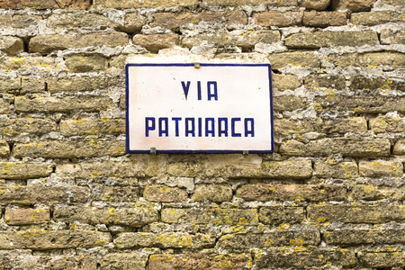 Street sign on red brick wall texture patternの写真素材