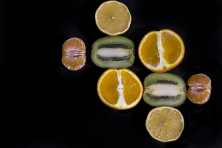 pieces of orange, lemon, kiwi, mandarin and pearの写真素材