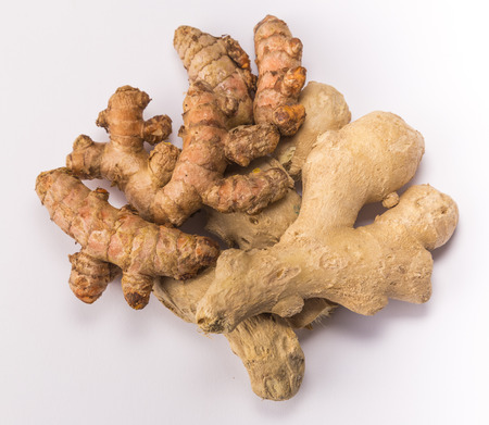 ginger and turmeric isolated on white background