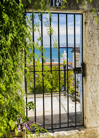 Unusual point of view of river Tejo from Alfama, Lisbon, Portugalの写真素材