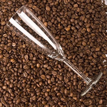 Glass on coffee beans backgroundの写真素材