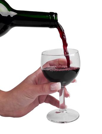 Glass of wine in woman hand on white backgroundの写真素材