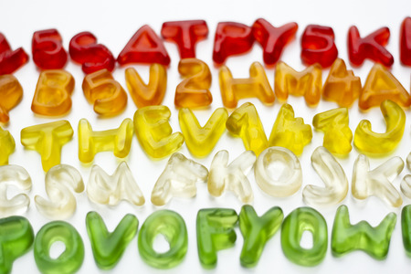 Gummy letters of latin alphabet on white backgroundの写真素材