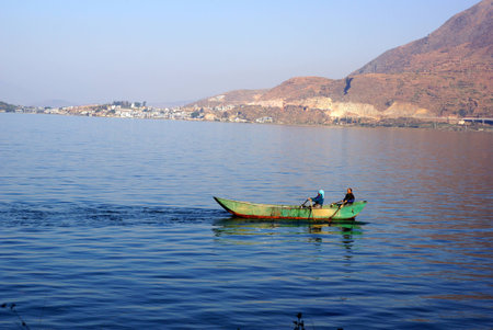People fishing on Erhail lake near Dali, Yunnan province, Chinaの写真素材